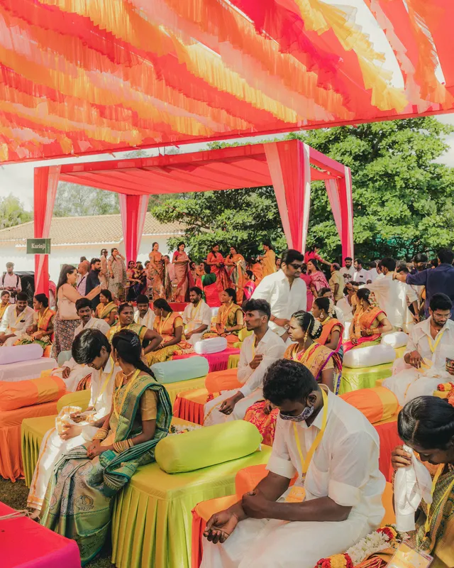 The 101 couples seated under the canopy at the record ceremony